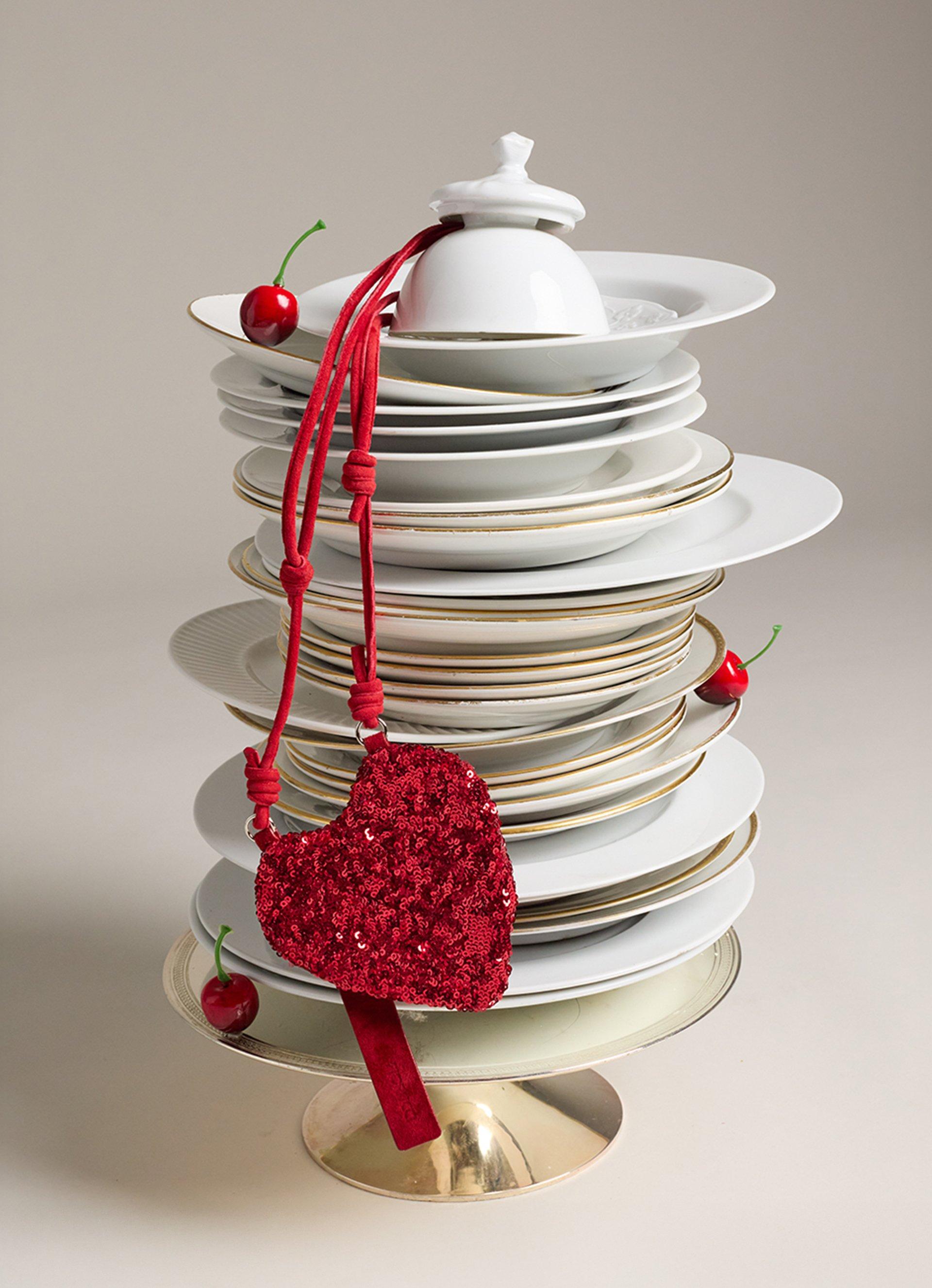 The picture features the Sequin Heart Mini Bag in Red.